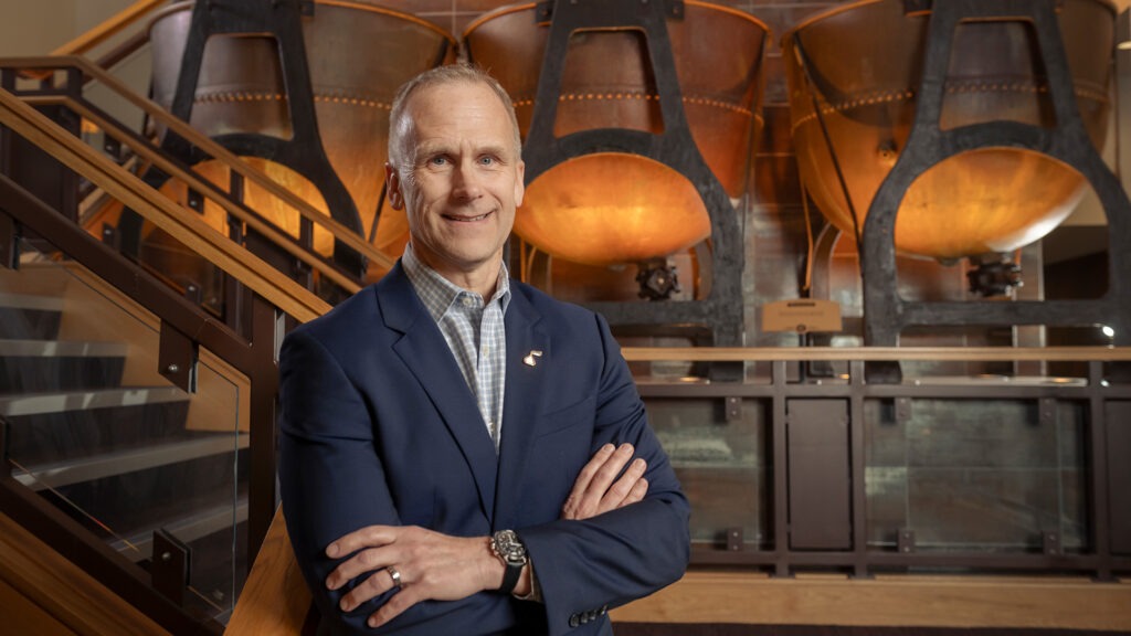 CFO Steve Voskuil standing in front of vats.