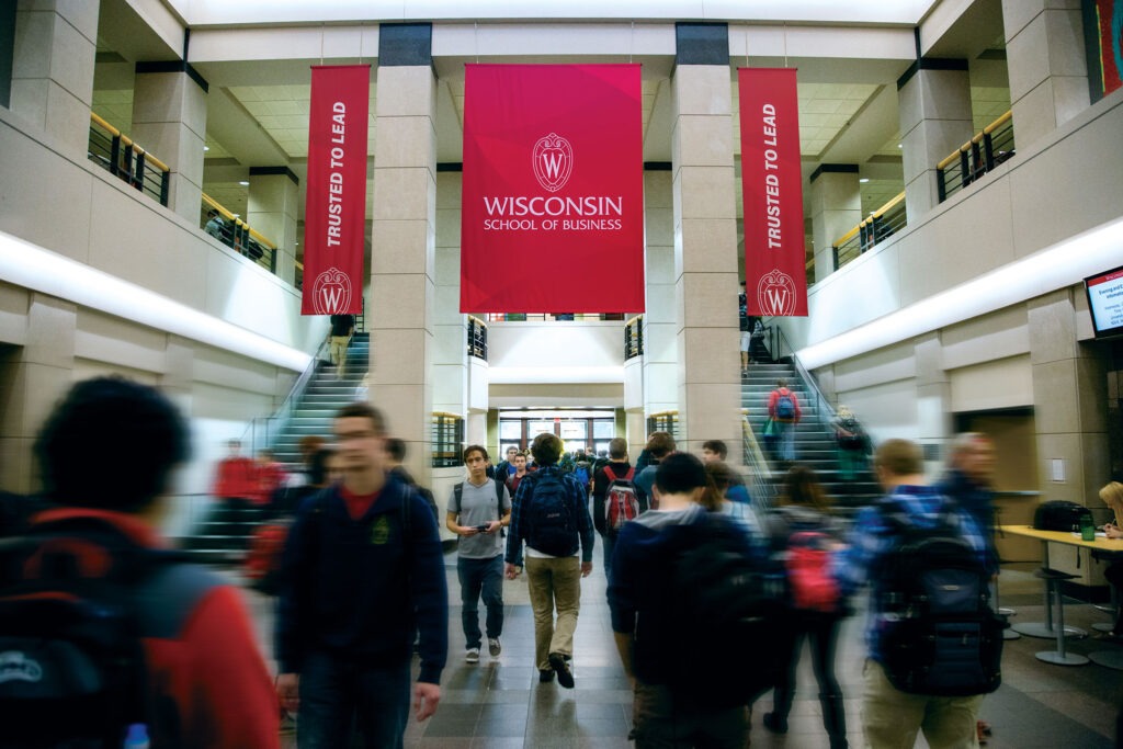 Inside of Grainger Hall with students walking around.