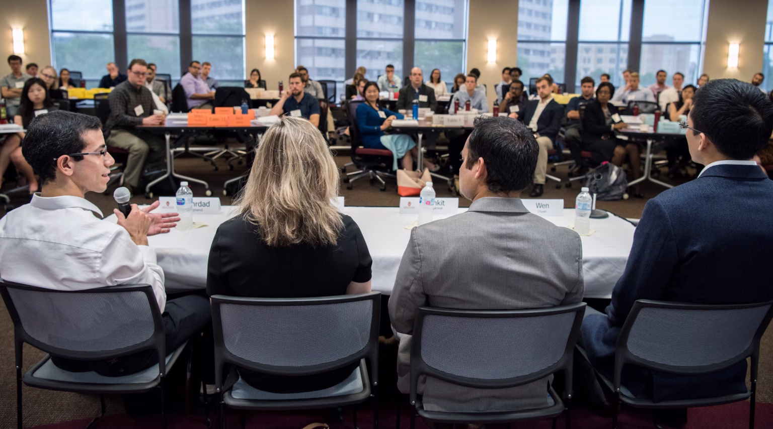 Four alumni panelists speak at an entrepreneur's lunch event.