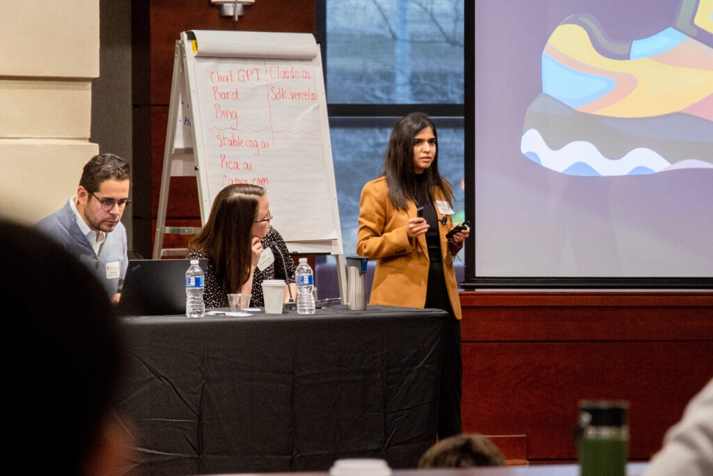 A woman talking at a generative AI workshop.