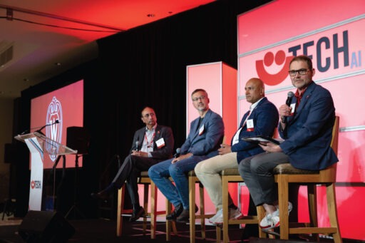 Speakers Vallabh “Samba” Sambamurthy, Remzi Arpaci-Dusseau, Devesh Ranjan, and moderator Kyle Buchmann take the stage at the Badgers in Tech event in Milwaukee