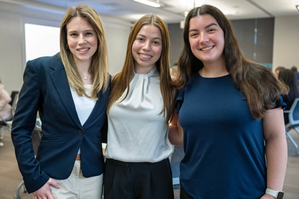 Three students at the external advisory board meeting.