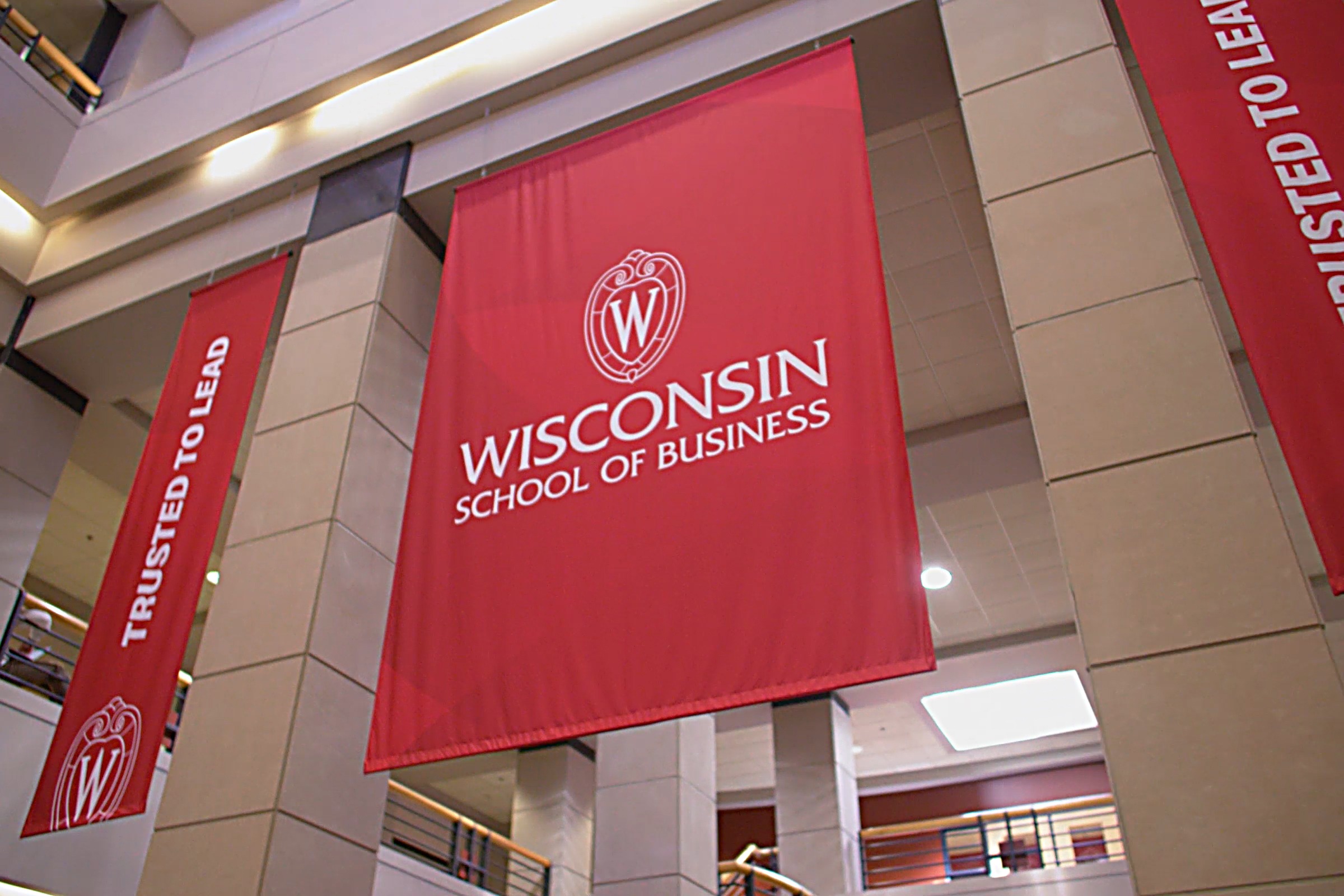 large red banners for Wisconsin School of Business: Trusted to Lead.