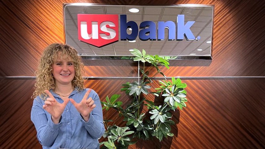 Megan McCarthy posing in front of US Bank.