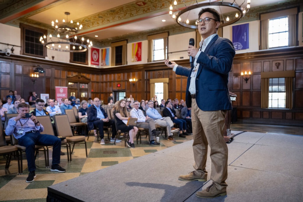 Professor presenting at AI Summit. 